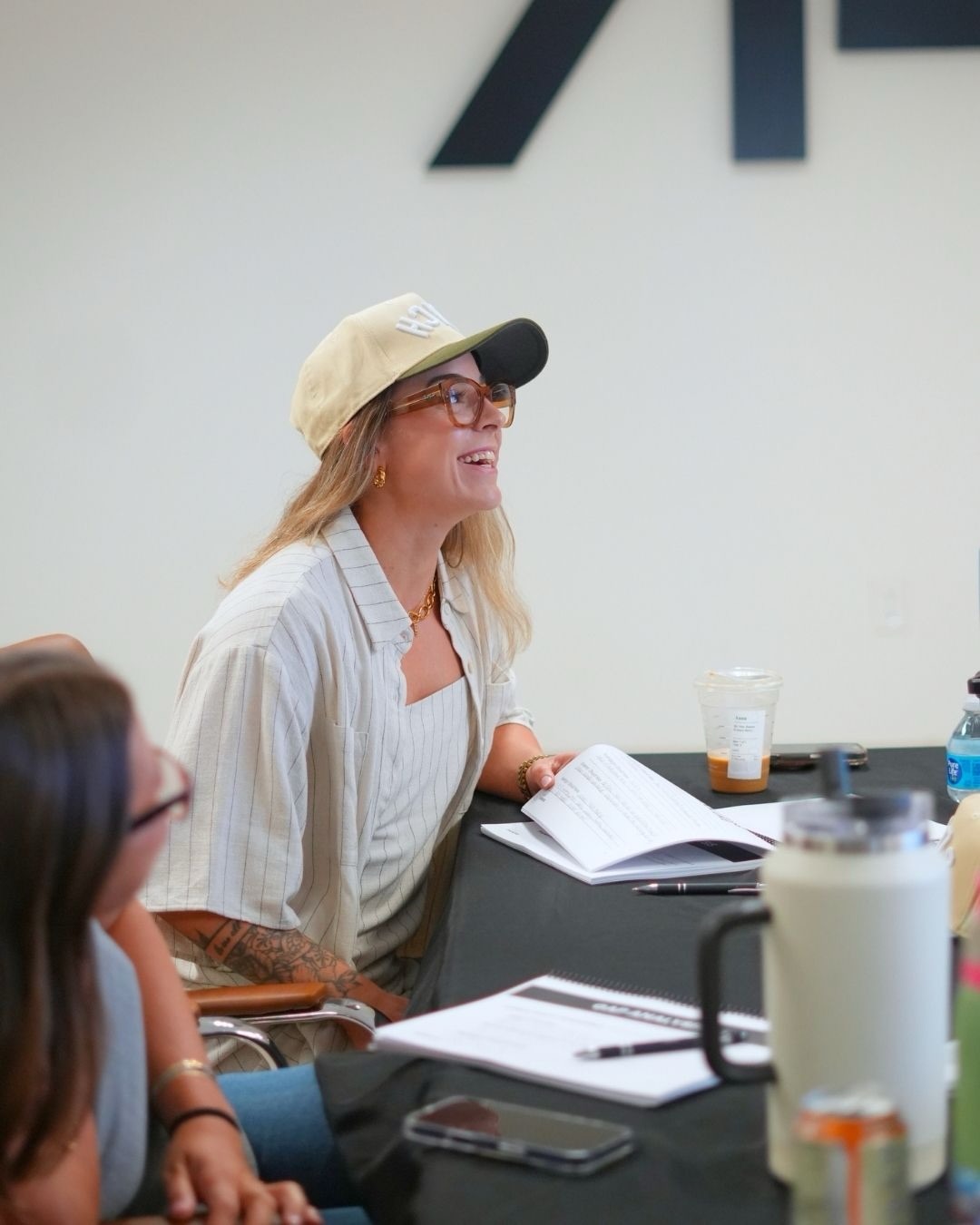 Dr. Anna wearing the AR COACH hat