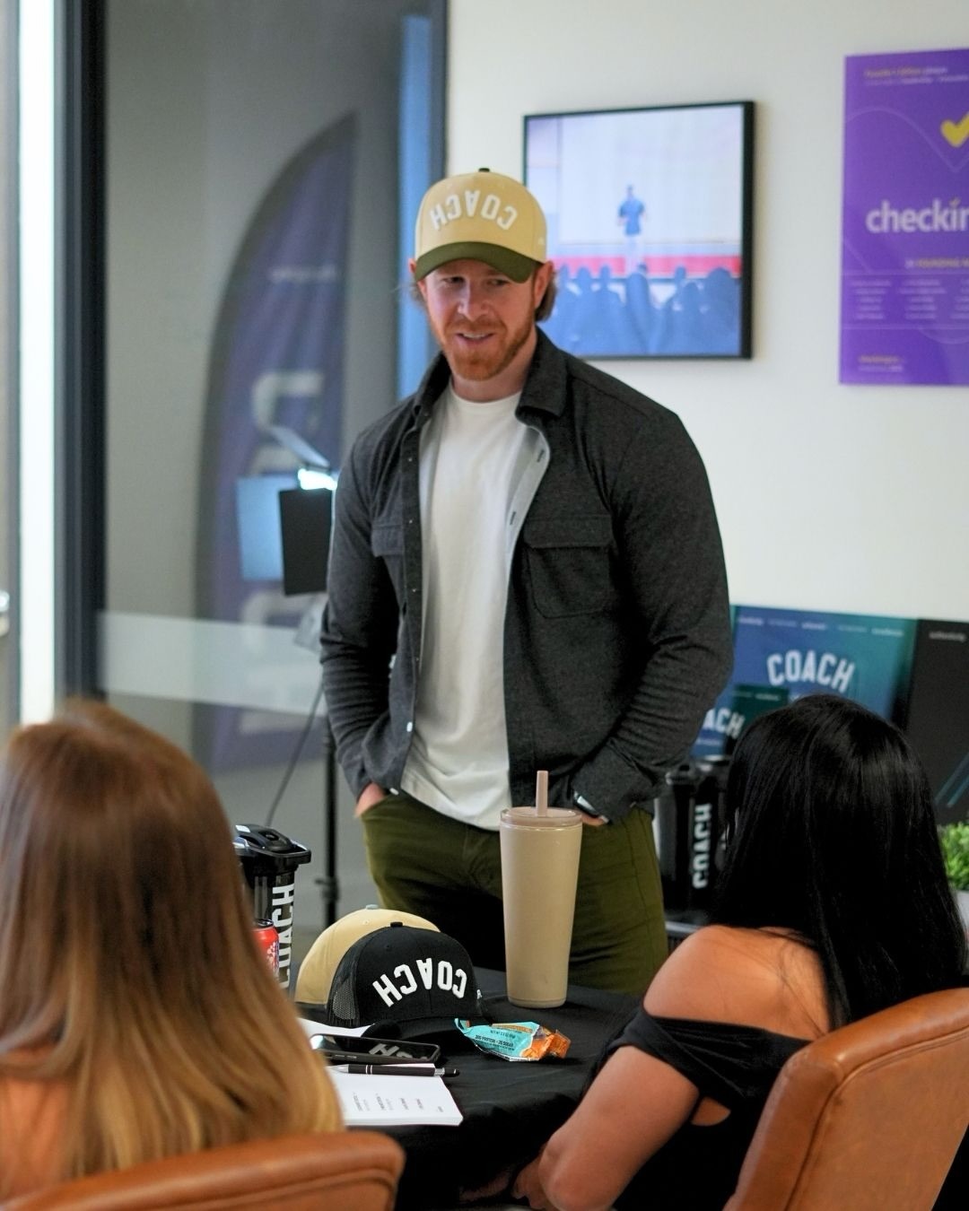 A coach wearing the AR COACH hat