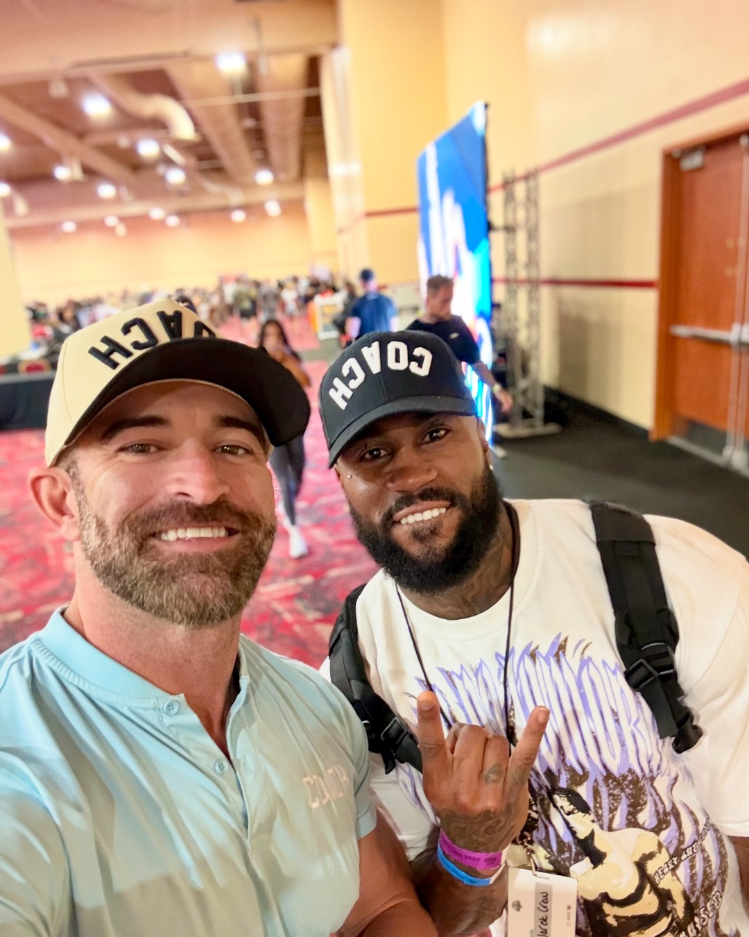 A coach wearing the AR COACH hat