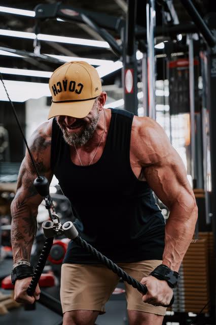 Mike Crowson grinning through a rope cable pushdown