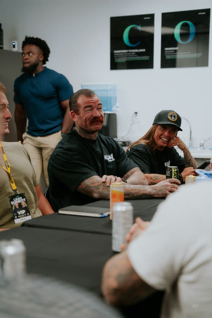Coaches laughing at the breakout tables