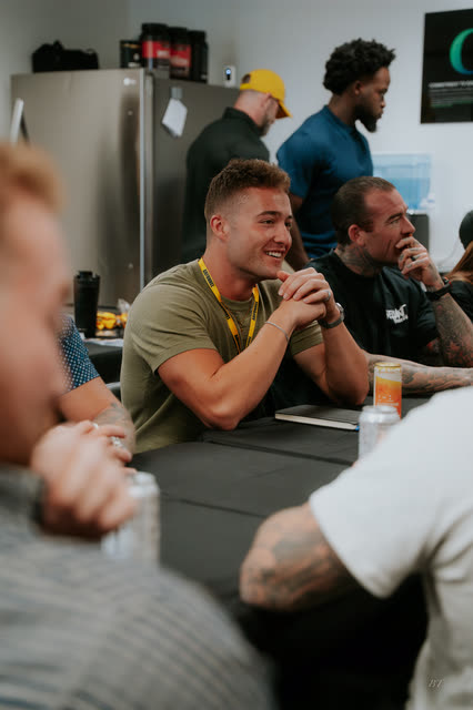 Coaches smiling at the breakout tables