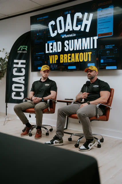 Bakker Shields and Mike Crowson seated under the COACH Lead Summit VIP Breakout screen