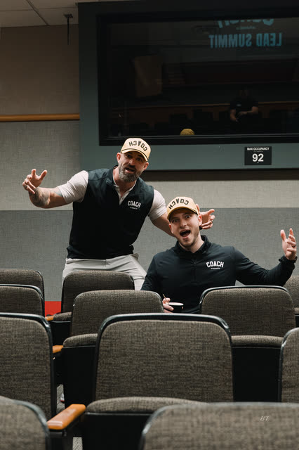 Mike Crowson and Bakker Shields hamming it up in the lecture hall seats